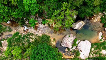 Aerial Drone Footage of a Clear Mountain Stream Flowing Through Mungyeong Countryside in Late Spring and Early Summer, Korea