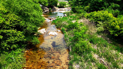 Aerial Drone Footage of a Clear Mountain Stream Flowing Through Mungyeong Countryside in Late Spring and Early Summer, Korea