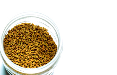 fenugreek seeds or methi dana isolated on white background
