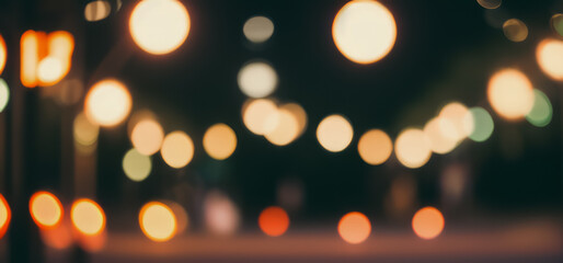 Obraz premium Blurred lights create a bokeh effect against a dark background abstract and festive.