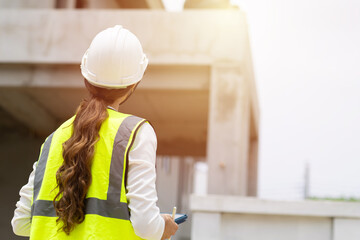 Construction engineer woman, architect contractor control operator worker at construction site...