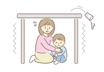 地震時に机の下に隠れる親子