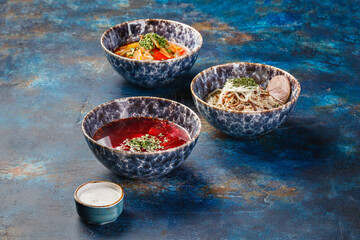 Different soups and sauses from different countries cousine with vegetables or meat