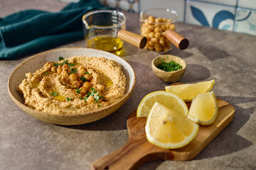 Delicious hummus with olive oil, chickpeas and parsley