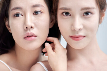 Two Young Women in Minimalist White Tank Tops, Close Up