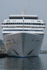 Ultra luxury all inclusive yacht cruiseship cruise ship liner Mariner docked at pier in Hakodate, Japan on Hokkaido island with city port harbor skyline panoramic scenic view