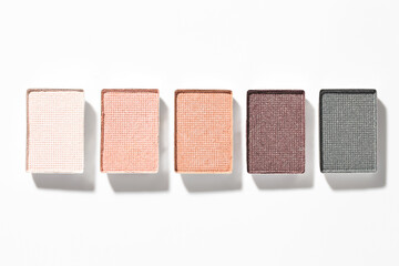 Beautiful eyeshadow refill pans on white background, flat lay