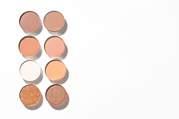 Beautiful eyeshadow refill pans on white background, flat lay. Space for text