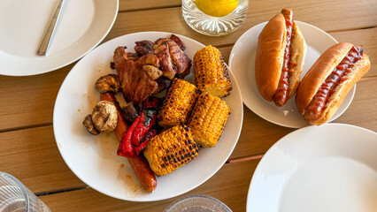 Grilled corn and succulent meats whisper summer BBQ stories, evoking Labor Day nostalgia and Latin...