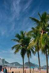 Fototapeta premium Rio de Janeiro, Brazil, May 19, 2025: Copacabana Beach is a beach located in the Copacabana neighborhood, in the South Zone of the city of Rio de Janeiro, Brazil. Beautiful blue skies and golden sand