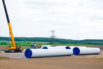 Giant Wind Turbine Parts:wind turbine blade and  tower, heavy industry construction site, concept...