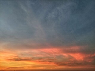 Dramatic sunset sky view with scattered clouds add texture and depth