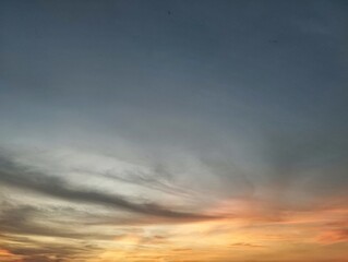 Dramatic sunset sky view with scattered clouds add texture and depth