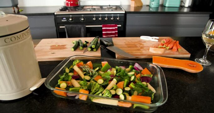 Preparing fresh vegetables in modern kitchen with wine and olive oil, at home
