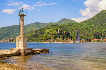 Beautiful sunny Mediterranean landscape.  Montenegro, Tivat. View of Bay of Kotor near Verige Strait. Kamenari town in distance