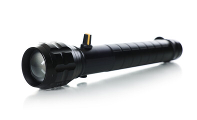 One modern black flashlight isolated on white