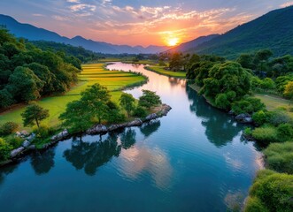 Obraz premium A picturesque landscape of Vietnam's vibrant rice fields and mountains, bathed in the golden glow of sunset.
