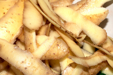 Close up of peeled peeling potatoes raw ready to cook