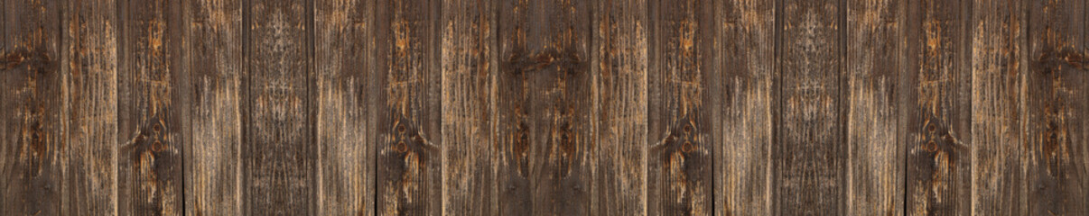 Naklejka premium shabby varnished brown yellow wooden background texture surface. Wood texture, Natural dark pattern brown old retro aged wood backdrop. top view of table floor wall