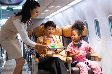 Passenger : African American daughter and mother  traveling by airplane. serving drinks.  Female...