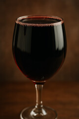 glass of red wine on dark background