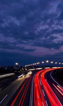 Vertical hyperlapse rise above highway traffic light trails at twilight | 9x16 4K