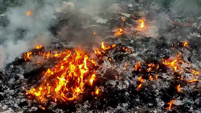 burning fire on rubbish pile