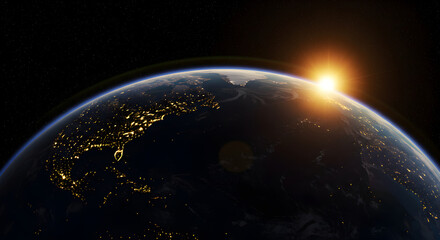 Obraz premium A stunning view of earth from space during sunrise with city lights visible