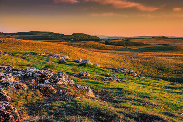 Evening landscape on the Aubrac mountains.
Field and hills on a beautiful spring evening in central...