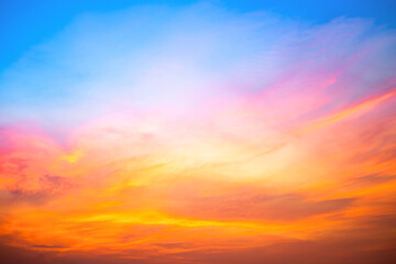 Sky,Beautiful sunset view, luxury soft gradient orange gold clouds and sunlight on the blue dramatic sky perfect for the background, morning, evening,Twilight, climate change,horizontal sunset photo