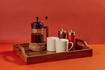 Rustic Coffee Bar Setup: coffee grinder, mugs, wooden tray