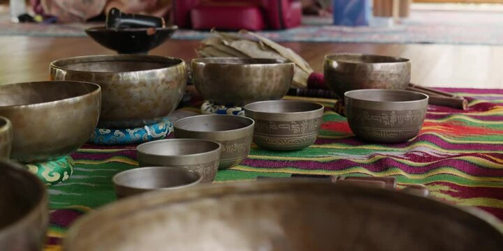 Tebet singing bowls stand on the floor before the start of the bowls ceremony