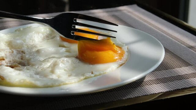 An Asia Chinese lady girl eat yolk egg on Restaurant . High quality 4k footage