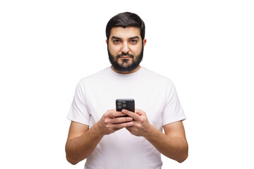 Man stands confidently while texting on his mobile device in a minimalistic setting, showcasing modern communication