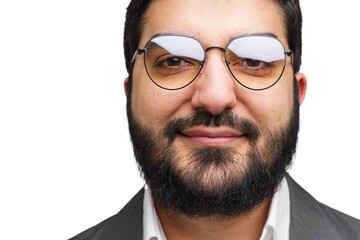 Confident man with glasses and a beard smiling warmly against a neutral background