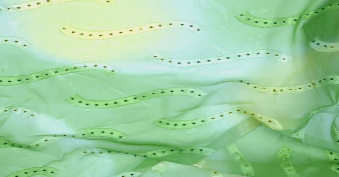 Seamless kaleidoscope. Fabric silk green-blue shades. Vibrant colors and scalloped shapes create a truly unique crepe de chine in yellow, blue and green geometric silk crepe de chine.