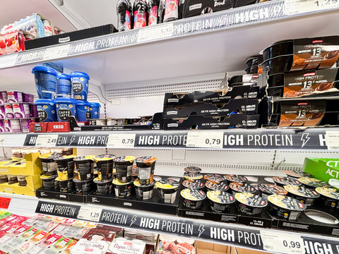 Alicante, Spain - May 27, 2025: High protein food products displayed on supermarket shelves, featuring various brands and packaging options for health-conscious consumers