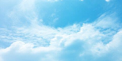 The blue sky and white clouds air indicate pure and fresh, bright weather canvas splashed with  store,m focusing on the clouds, a sunny day 