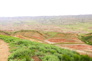 Colorful spectacular panoramic view of rainbow mountains hills in Georgia. Striped desert of Mravaltskaro mountains at the border of Georgia and Azerbaijan. Famous tourist place