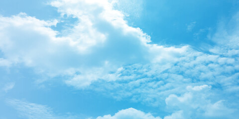 The blue sky and white clouds air indicate pure and fresh, bright weather canvas splashed with  store,m focusing on the clouds, a sunny day 