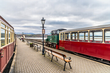 A view down the platform at the railway station at Porthmadog, Wales in springtime