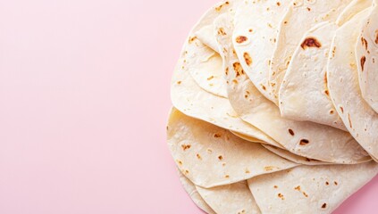 Stack of Tortillas on Pink Background