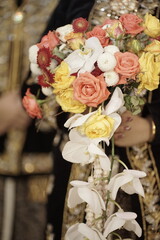 Vibrant Wedding Bouquet Roses, Orchids, and Coral Blooms