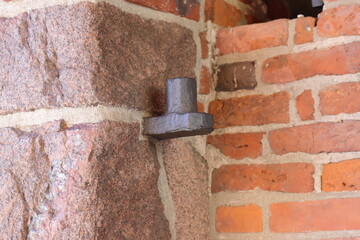 Iron hinge in a stone wall