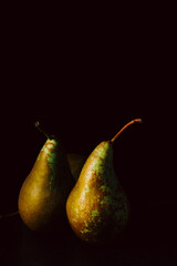 Pears on dark background.