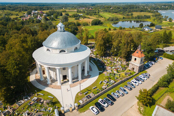 Aerial View of Round Church of the Holy Trinity Building Surrounded by Cemetery in Suderve Town Near Vilnius