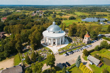 Aerial View of Round Church of the Holy Trinity Building Surrounded by Cemetery in Suderve Town Near Vilnius