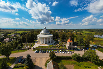 Aerial View of Round Church of the Holy Trinity Building Surrounded by Cemetery in Suderve Town Near Vilnius
