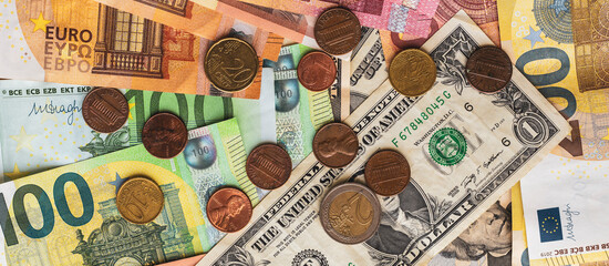 scattered banknotes and coins