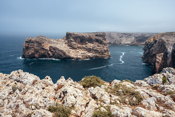 San Vicente Cape cliffs in the Algarve region of Portugal in a sunny day.